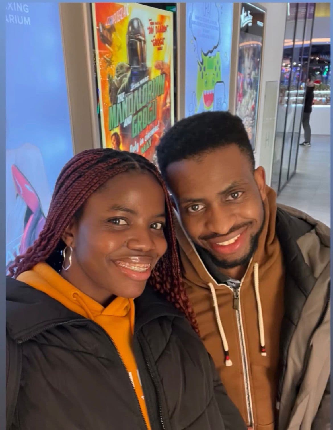 David and Esther smiling in a hallway